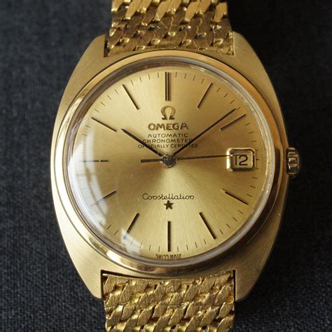 omega constellation solid gold